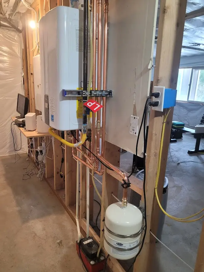 Licensed plumber repairing a kitchen sink in Burton
